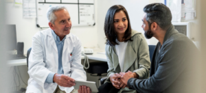 Doctor discussing with two people