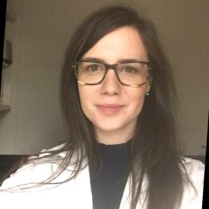 Young women with long brown hair wearing glasses. Headshot of Dr. Melissa O'Brien