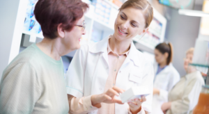 A woman receives help from a pharmacist.