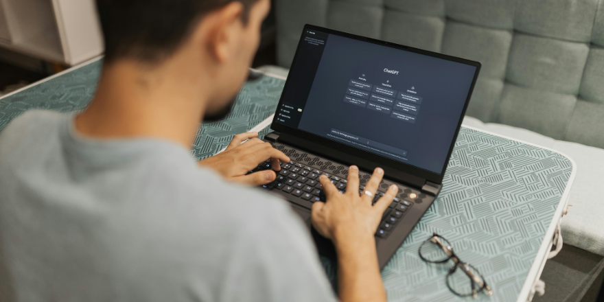 Man using chatgpt on a laptop